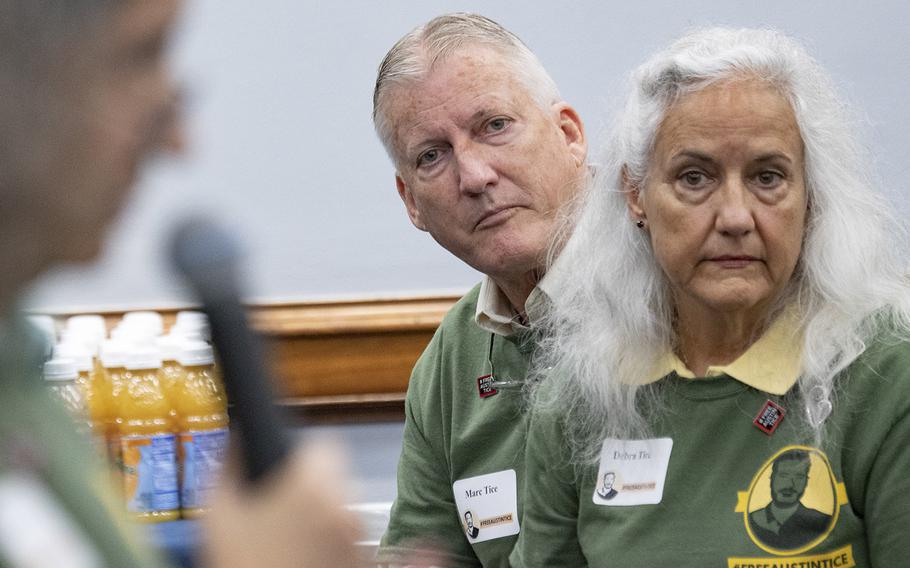 Marc and Debra Tice, parents of Austin Tice, listen as Julie Moos gives instructions to volunteers who are about to distribute information about the missing journalist to Capitol Hill offices, Sept. 23, 2019.