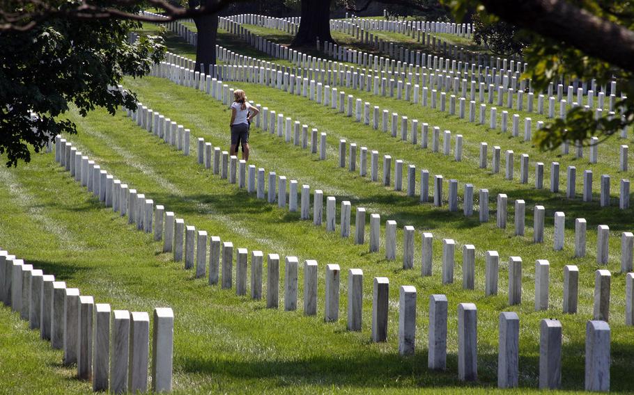 A guest visits graves at Arlington National Cemetery in Virginia in an undated photo.