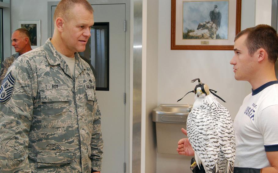 Cadet 2nd Class Michael O'Kelley talks to Chief Master Sgt. James Roy about the Air Force Academy's falconry program during a visit to the academy's mews Oct. 1, 2010. The mews is a special facility designed to house the academy's 12 falcons, including Aurora.