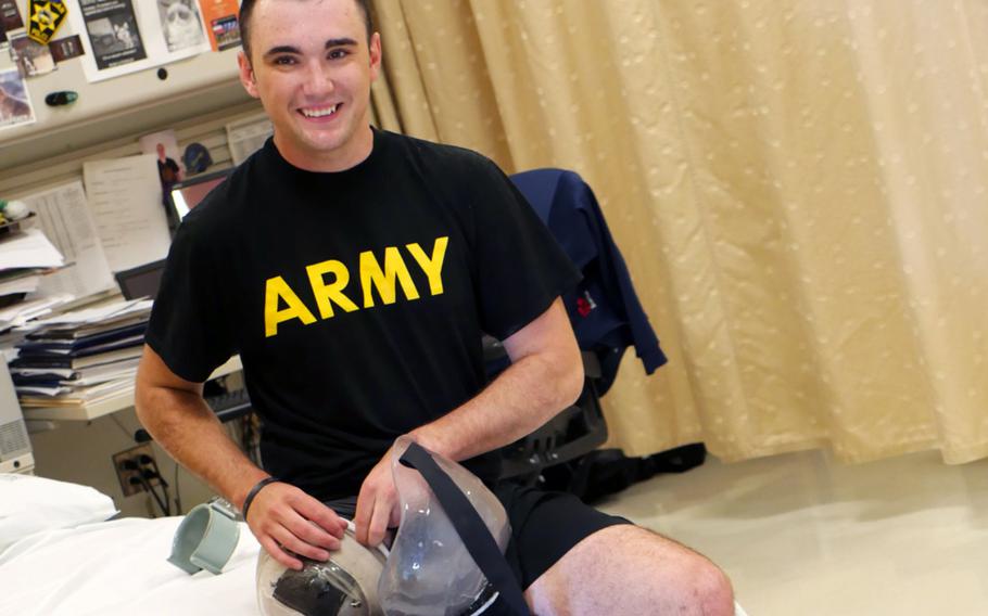 Spc. Ezra Maes adjusts his prosthetic leg prior to physical rehabilitation at the Center for the Intrepid, Brooke Army Medical Center's cutting-edge rehabilitation center on Joint Base San Antonio-Fort Sam Houston, Oct. 2, 2019.