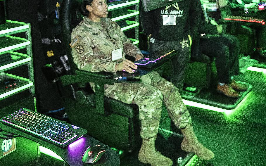 A soldier plays a video game in the U.S. Army Esports trailer at the AUSA 2019 Annual Meeting in Washington on Tuesday, Oct. 15, 2019.