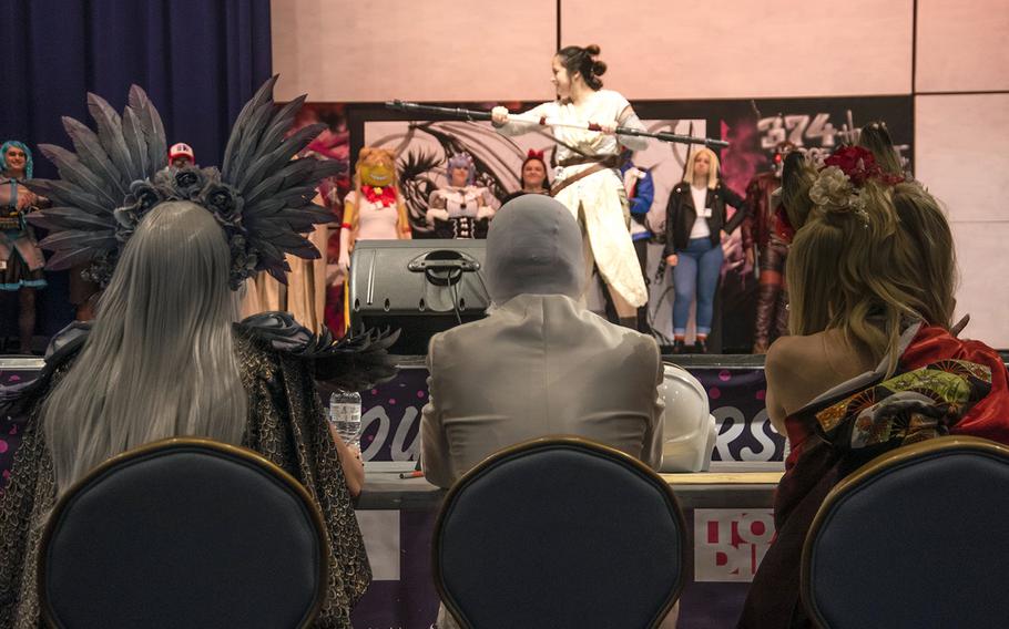 Amateur cosplayers show off for a panel of judges during the inaugural Yokota-Con at Yokota Air Base, Japan, Saturday, Oct. 19, 2019.  
