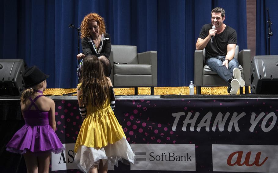 Actors Olivia Hack, who played Cindy Brady in "The Brady Bunch Movie," and Dan Payne, best known for his role in the horror film "The Cabin in the Woods," answer questions during Yokota-Con at Yokota Air Base, Japan, Saturday, Oct. 19, 2019.  