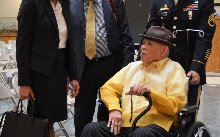 Josephine Manzano-Stettler talks to her father Jose Manzano-Somera on Friday at Fort Hood, Texas, following his receiving of the Congressional Gold Medal. The veterans served three years in the Philippine Scouts of the U.S. Army immediately following World War II.