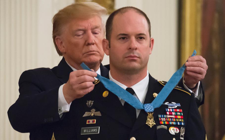 President Donald Trump awards Master Sgt. Matthew O. Williams with the Medal of Honor during a ceremony at the White House on Wednesday, Oct. 30, 2019.