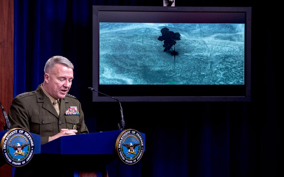 Video of the Abu Bakr al-Baghdadi raid is displayed as U.S. Central Command Commander Marine Gen. Kenneth McKenzie speaks, Wednesday, Oct. 30, 2019, at a joint press briefing at the Pentagon in Washington. 