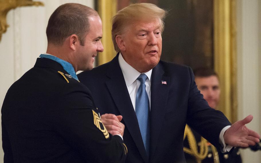 President Donald Trump shakes hands with Master Sgt. Matthew Williams who received the Medal of Honor during a ceremony at the White House on Wednesday, Oct. 30, 2019. Trump lauded Williams who continues to serve as an active-duty soldier, a rare occurrence for Medal of Honor recipients. "We salute your unyielding service, your unbreakable resolve, and your untiring devotion to our great nation," Trump said. 