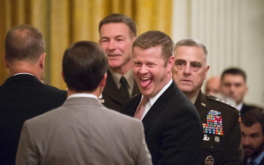 Army Secretary Ryan McCarthy shares a moment of levity with Defense Secretary Mark Esper prior to the start of a Medal of Honor ceremony at the White House in Washington on Oct. 30, 2019. Looking on in the background are Chairman of the Joint Chiefs of Staff Army Gen. Mark Milley, right, and Army Chief of Staff Gen. James McConville. At the start of Wednesday's ceremony, President Donald Trump praised America's top military brass for "the incredible act you performed" in the operation that killed Islamic State leader Abu Bakr al-Baghdadi.