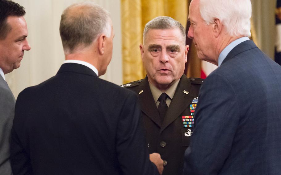 Chairman of the Joint Chiefs of Staff Army Gen. Mark Milley speaks with Senators John Cornyn, right, Thom Tillis, center, and Rep. Richard Hudson prior to the start of a Medal of Honr ceremony at the White House in Washington on Wednesday, Oct. 30, 2019.