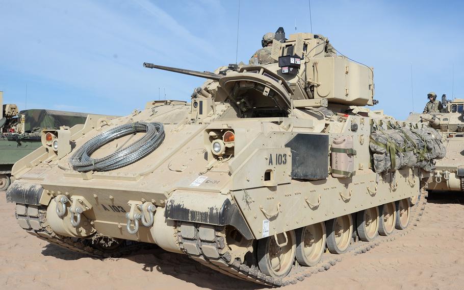 In an August, 2018 photo, soldiers of the 4th Battalion, 118th Infantry Regiment, South Carolina National Guard prepare for a convoy with M2 Bradley Fighting Vehicles during Operation Hickory Sting at Ft. Bliss, Texas.