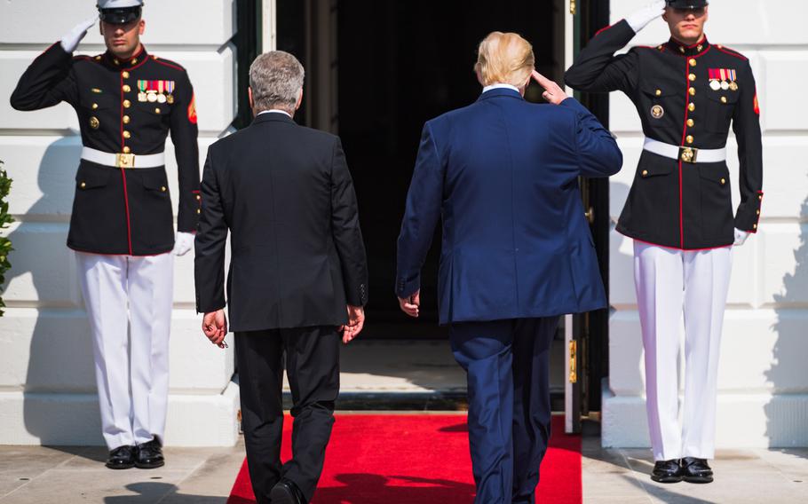 U.S. Marines salute President Donald Trump as he walks with Finnish President Sauli Niinistö in Washington, D.C., Oct. 2, 2019. All Marines wearing their dress or service uniforms are now allowed to use umbrellas, ending a long tradition and bringing the Corps generally in line with other services. They must be carried in the left hand to allow for salutes, according to existing regulations.

Zachery Perkins/U.S. Army