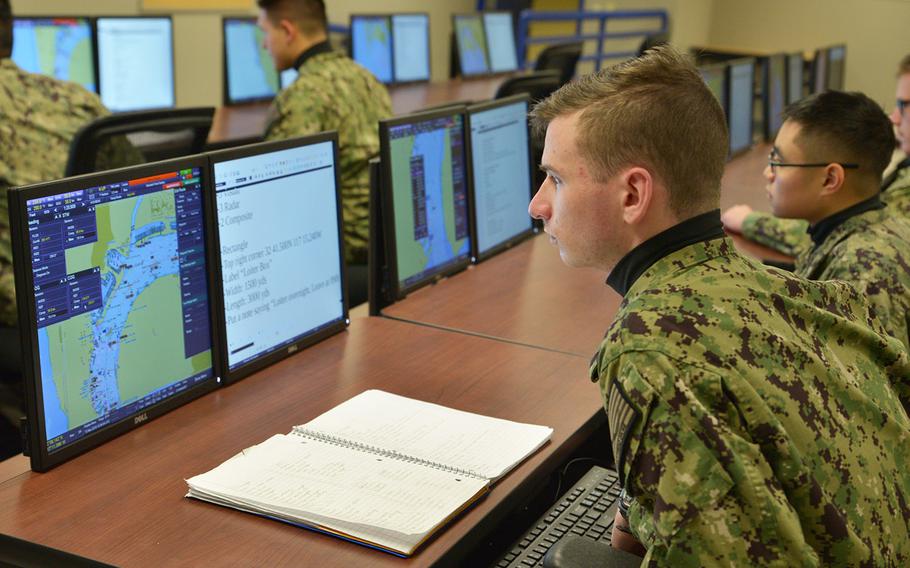Center for Surface Combat Systems Unit Great Lakes Operations Specialist "A" School student Seaman Christian Foster studies in the Voyage Management System (VMS) lab Nov. 13, 2019.