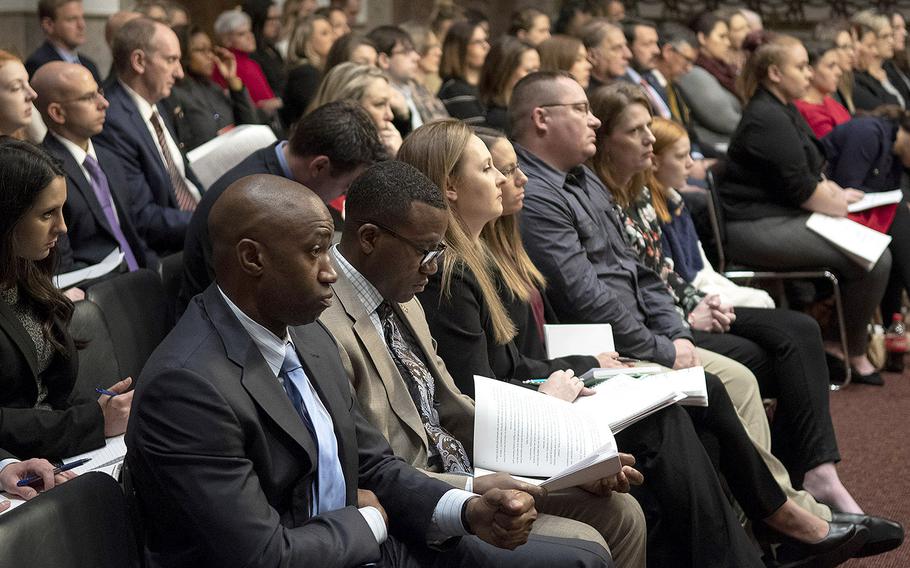 Audience members listen during a hearing on privatized military housing, December 3, 2019, on Capitol Hill.