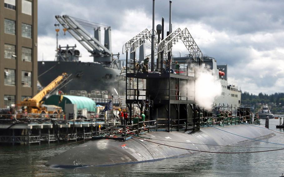 In an August 10, 2019 photo, USS Connecticut departs Puget Sound Naval Shipyard & Intermediate Maintenance Facility’s Dry Dock 4 in Bremerton, Wash., during a 5½-month period of maintenance and modernization that's formally known as a docking continuous maintenance availability. 