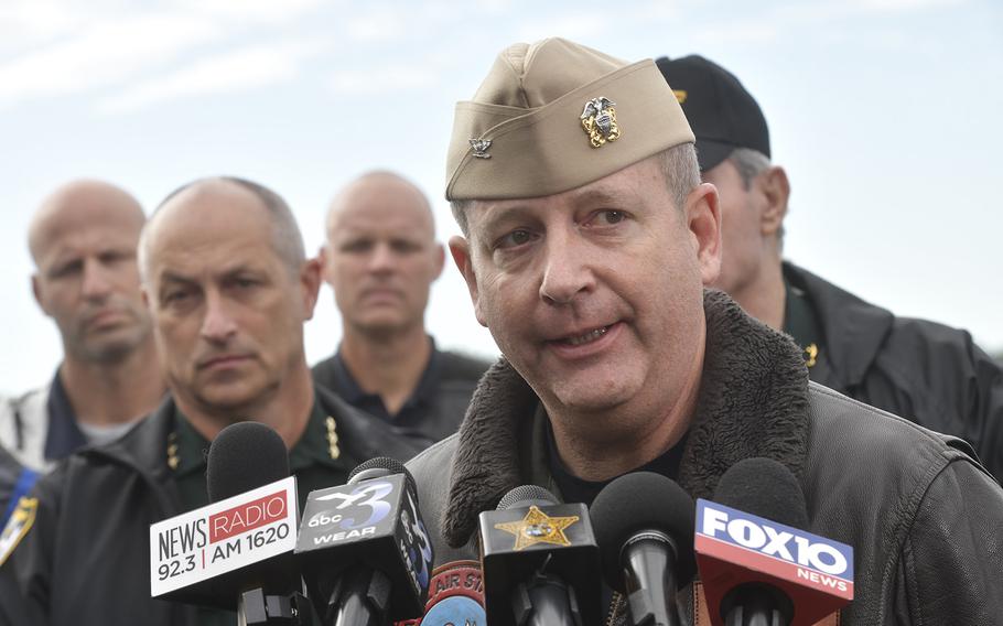 Navy Capt. Tim Kinsella briefs members of the media following a shooting at the Naval Air Station in Pensacola, Fla., Friday, Dec. 6, 2019. A U.S official told The Associated Press that the suspect was a Saudi aviation student, and that authorities are investigating whether the shooting was terrorism-related.