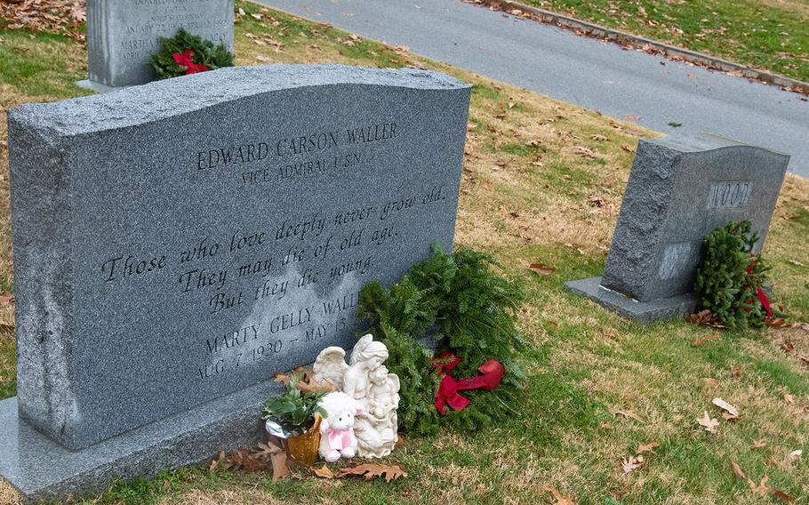 A wreath and statue at the grave of Vice Adm. Edward C. Waller during Wreaths Across America at the United States Naval Academy Cemetery in Annapolis, Md., December 13, 2019. Waller served as the academy's superintendent from 1981 to 1983.