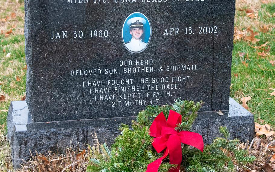 A wreath at the grave of Midshipman Kenneth Neptun during Wreaths Across America at the United States Naval Academy Cemetery in Annapolis, Md., December 13, 2019. Neptun died of leukemia weeks before he was to graduate from the academy in 2002.