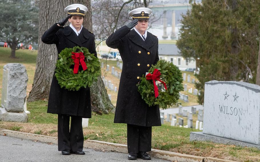 Midshipmen salute during Wreaths Across America at the United States Naval Academy Cemetery in Annapolis, Md., December 13, 2019.