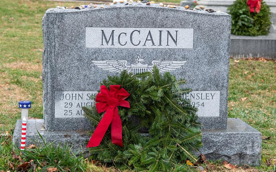 A wreath is placed at the grave of Sen. John McCain during Wreaths Across America at the United States Naval Academy Cemetery in Annapolis, Md., December 13, 2019.