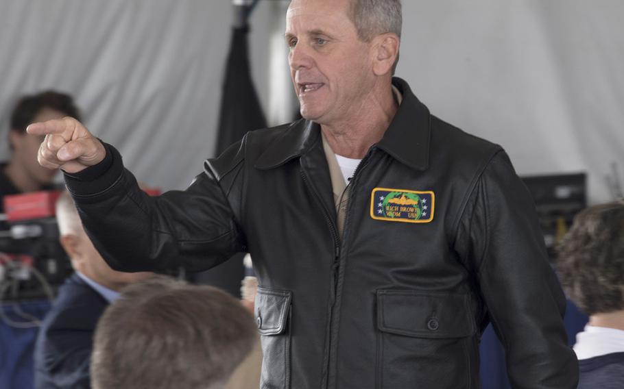 Wearing a leather jacket similar to those now being made available to Navy surface warfare officers, Vice Adm. Richard A. Brown, Commander, Naval Surface Forces, delivers the keynote address at a symposium on board Naval Base San Diego, Aug. 22, 2019.