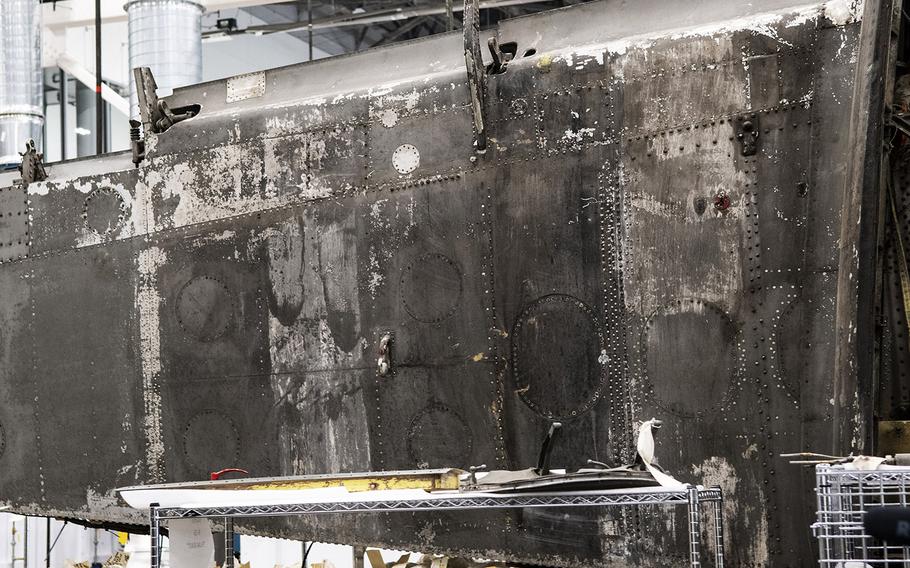 Invasion stripes, used to help allied aircraft avoid friendly fire during the D-Day landings in Europe, atill show faintly on a wing of the Martin B-26B-25-MA Marauder "Flak-Bait," being restored at the Smithsonian's Udvar-Hazy Center in January, 2020.