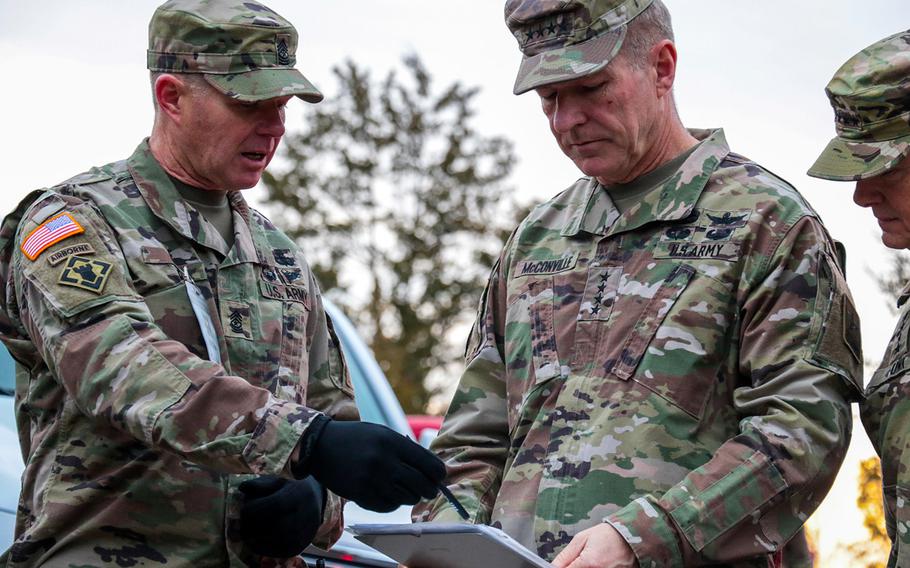 Sgt. Maj. Curtis Cox, the noncommissioned officer in charge in the field of the Leader Reaction Course, briefs Gen. James C. McConville, the Army's chief of staff, about the challenges and assessment criteria for each candidate during McConville's visit to the Battalion Commander Assessment Program Jan. 23, 2020, at Fort Knox, Ky.