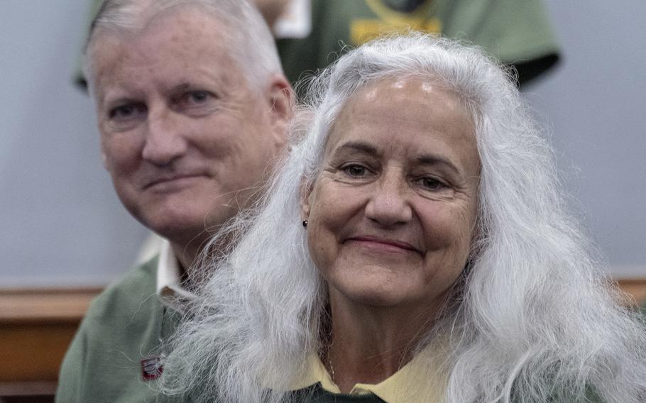 Marc and Debra Tice, parents of Austin Tice, listen as Julie Moos gives instructions to volunteers who are about to distribute information about the missing journalist to Capitol Hill offices, Sept. 23, 2019.