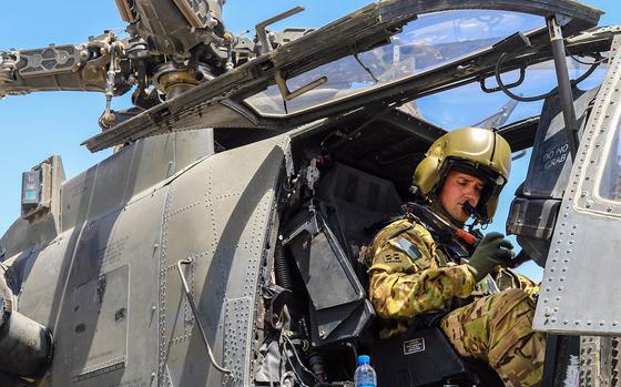 A U.S. Army AH-64 Apache pilot conducts final preflight checks before taking off in Afghanistan in April 2019. The Army announced new bonuses for pilots to try to keep them from being lured away by higher pay and better benefits paid by commercial airlines. 

Roxana Thompson/U.S. Army