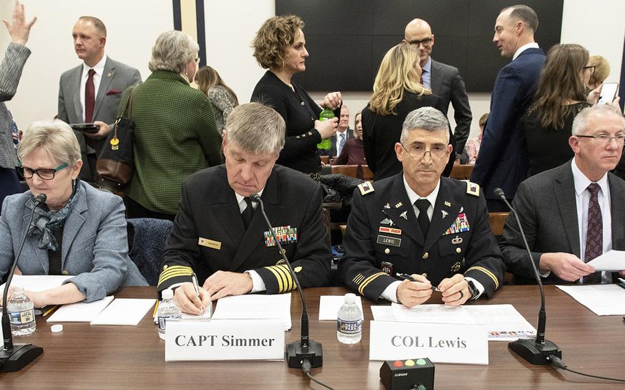 Awaiting the start of the second panel of a Feb. 5, 2020 House hearing on the Exceptional Family Member Program on Capitol Hill are, left to right, Carolyn Stevens, director of the DOD's Office of Military Family Readiness Policy; Capt. Edward Simmer, chief clinical officer for Tricare health plans at the Defense Health Agency; Col. Steve Lewis, deputy director of the Army's Quality of Life Task Force and Army family advocacy program manager; and Ed Cannon, director of fleet and family readiness at the Navy Installations Command.