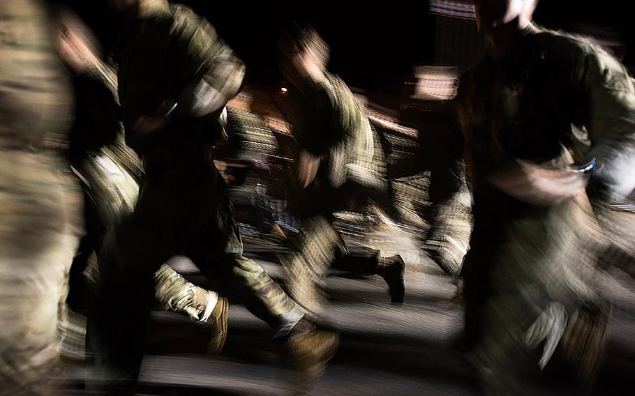 U.S. Army Rangers are seen as a blur as they compete in the eight-mile run during the Best Ranger Competition, Apr. 12, 2019, at Fort Benning, Ga.