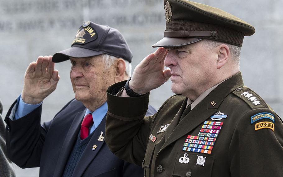 Iwo Jima battle veteran Ira Rigger and Joint Chiefs of Staff Chairman Gen. Mark Milley salute during the playing of the national anthem at a 75th anniversary ceremony, Feb. 19, 2020 at the National World War II Memorial in Washington, D.C.