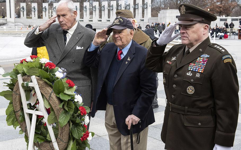 Friends of the National World War II Memorial Chairman Josiah Bunting III, Iwo Jima battle veteran Ira Rigger and Joint Chiefs of Staff Chairman Gen. Mark Milley salute during a wreath laying at a 75th anniversary ceremony, Feb. 19, 2020 at the National World War II Memorial in Washington, D.C.