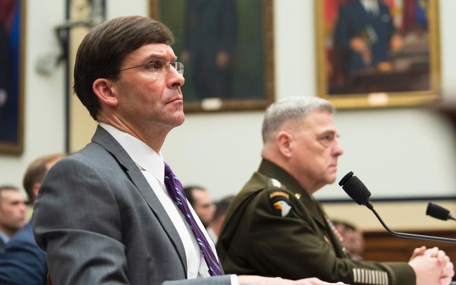 Defense Secretary Mark Esper and Chairman of the Joint Chiefs of Staff Gen. Mark Milley listen to a question during a House Armed Services Committee hearing on Capitol Hill in Washington on Wednesday, Feb. 26, 2020. 