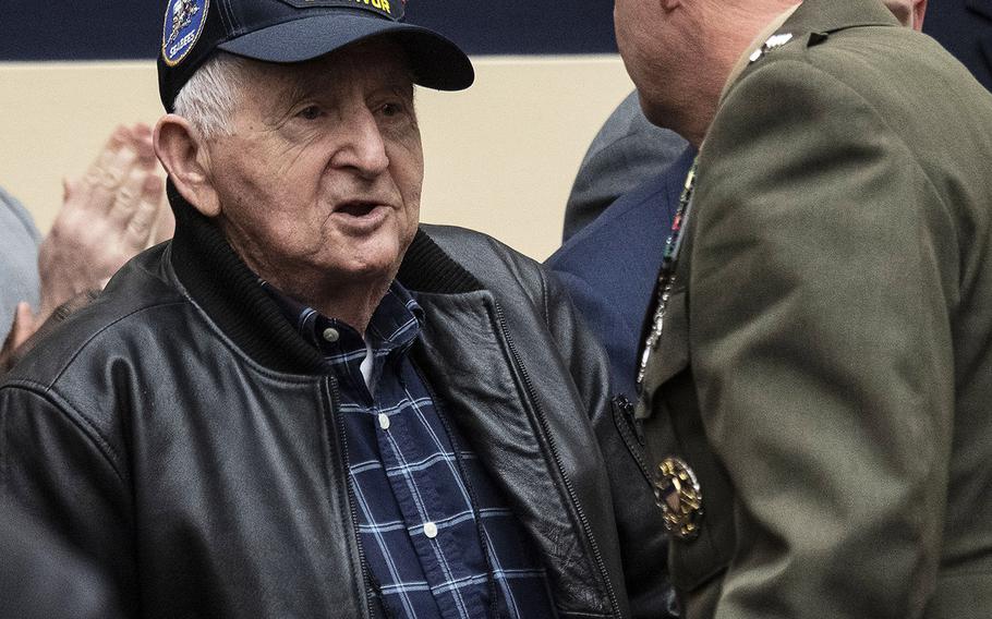 Former Navy Petty Officer 2nd Class Clinton Trefethen, 98, an Iwo Jima battle veteran, shakes hands with U.S. Marine Corps Commandant Gen. David H. Berger after being introduced at a House Armed Services Committee hearing on Capitol Hill, Feb. 27, 2020.