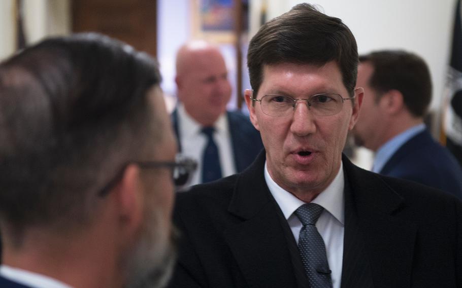 Retired Air Force Master Sgt. Paul Widener speaks outside a hearing room in the House Rayburn building on Capitol Hill in Washington on Thursday, Feb. 27, 2020, after testifying about his deployment to the K2 base in Uzbekistan shortly after the 9/11 terrorist attacks.