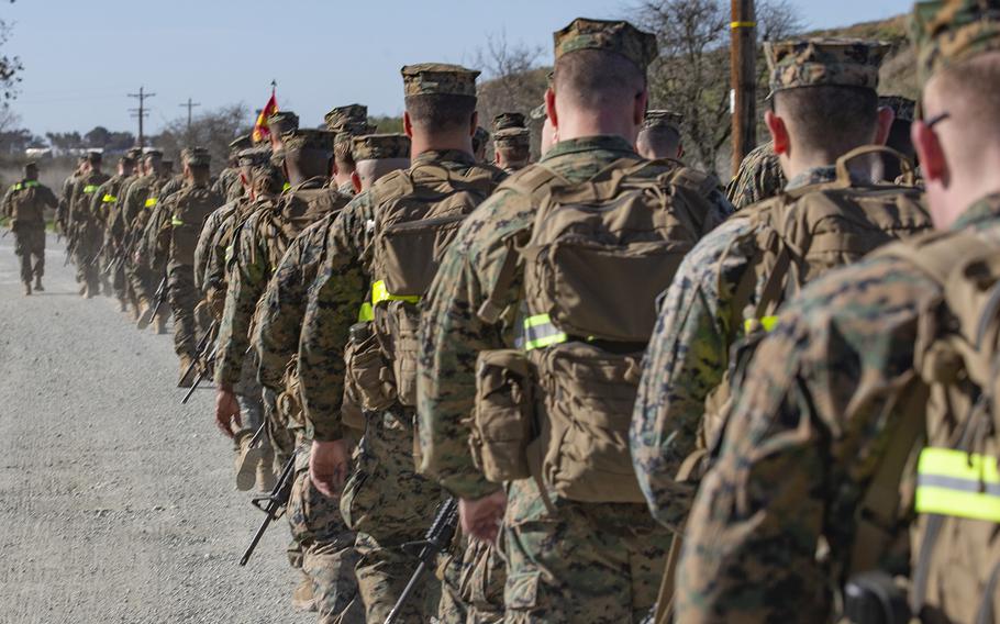 U.S. Marines with Headquarters Company, 13th Marine Expeditionary Unit, I Marine Expeditionary Force, conduct a conditioning hike for pre-deployment training at Marine Corps Base Camp Pendleton, Calif., Jan. 30, 2019.