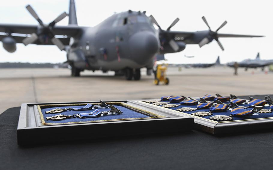 Two Distinguished Flying Crosses and 12 Air Medals lay on a table before a presentation ceremony at Hurlburt Field, Florida, Mar. 2, 2020.