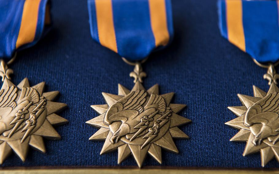 Air Medals lay on a table before a presentation ceremony at Hurlburt Field, Florida, Mar. 2, 2020.