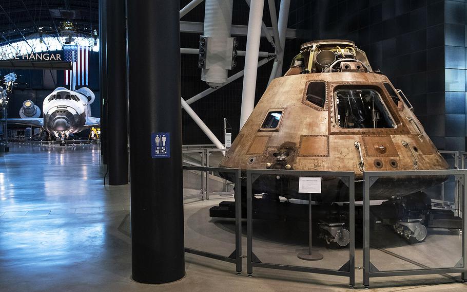 Space shuttle Discovery and the Apollo 11 command module, on display at the Smithsonian's Udvar-Hazy Center in Virginia on March 3, 2020.