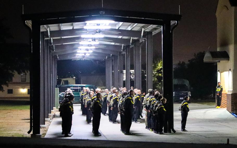 Before recruits are able to take part in Basic Combat Training like these recruits standing in formation before dawn at Fort Jackson, S.C., in November 2019, they'll have to be screened for coronavirus.