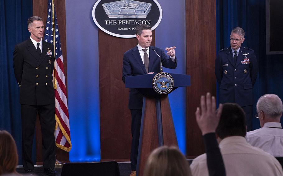 Assistant to the Secretary of Defense for Public Affairs, Jonathan Rath Hoffman, along with Vice Director of the Joint Staff, Rear Adm. William D. Byrne Jr., and Joint Staff Surgeon, Joint Chiefs of Staff, Brig. Gen. (Dr.) Paul Friedrichs, hold a press conference in the Pentagon Briefing Room March, 10, 2020.