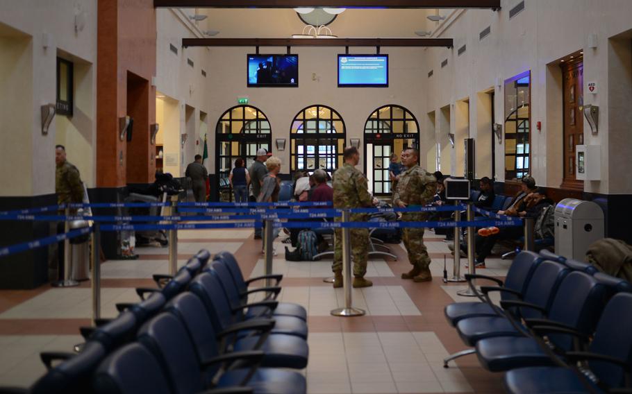 Passengers wait to board a Patriot Express service at Aviano Air Base, Italy, April 4, 2019. 