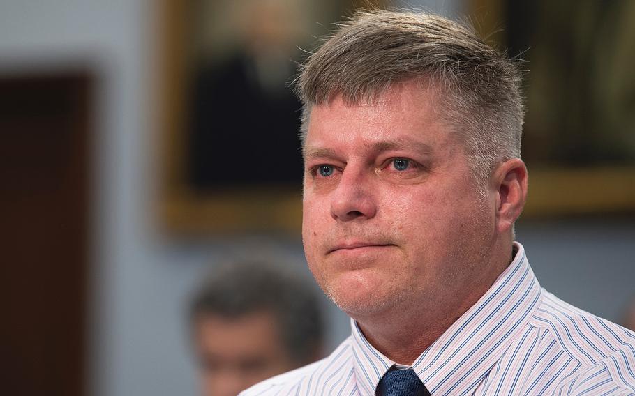 Retired Army helicopter pilot Jim Holmes, who also served in the Air Force, testifies during a House Appropriations Subcommittee on Veterans Affairs on Capitol Hill in Washington on Wednesday, March 11, 2020. Holmes said he never imagined that his 17-year old daughter Kaela, who died in March 2019, "would be the one paying the ultimate price" for his service, which exposed his family to toxic base water.