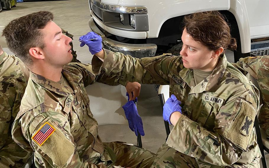 Medics with the Louisiana Army and Air National Guard conduct training with the Department of Health and Human Services to ensure proper protection and administering of drive-thru testing, March 18, 2020, in New Orleans. 