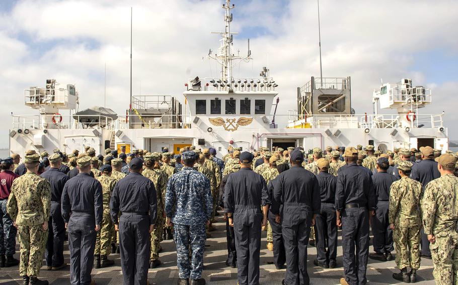 In a Sept 23, 2018 photo, sailors stand in formation during an all hands call aboard Military Sealift Command hospital ship USNS Mercy in the Pacific Ocean.