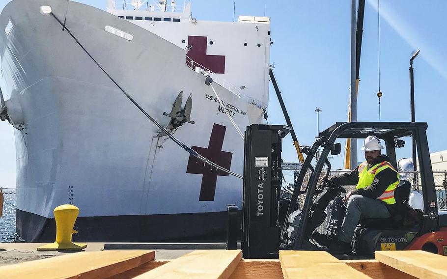 Naval Facilities Engineering Command Southwest forklift driver Steve King prepares to deliver pallets during a supply load aboard Military Sealift Command hospital ship USNS Mercy at Naval Base San Diego, March 21, 2020.