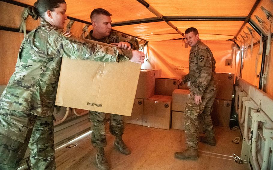 Members of the West Virginia National Guard assist with the logistical movement and delivery of in-demand medical supplies to hospitals, clinic, and local departments of health throughout West Virginia in support of COVID-19 pandemic outbreak response efforts on Tuesday, March 24, 2020, in Poca, W.Va. 