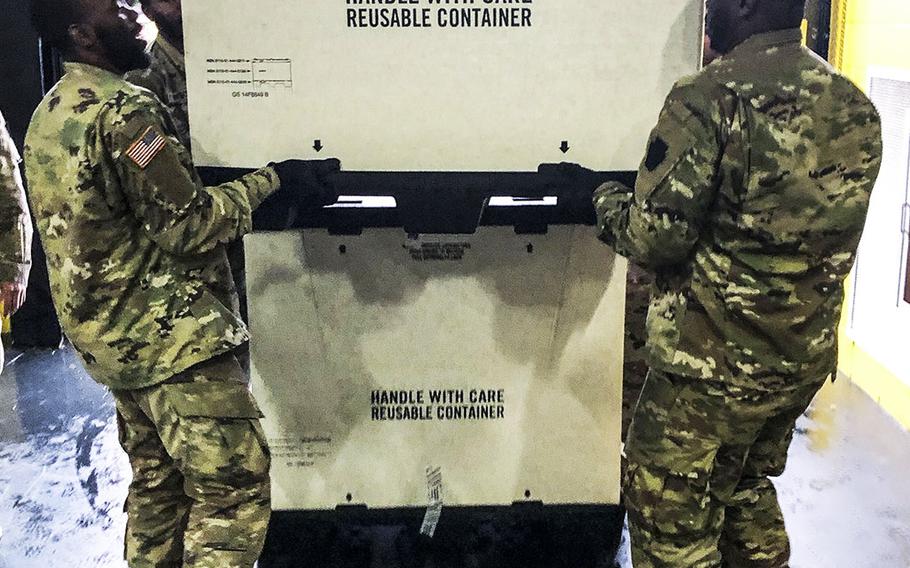 Soldiers from the 103rd Engineer Battalion, Pennsylvania. National Guard, provide logistical assistance to FEMA at the Glen Mills School in Glenn Mills, Pa., where they unloaded federal equipment to establish a federal medical station.