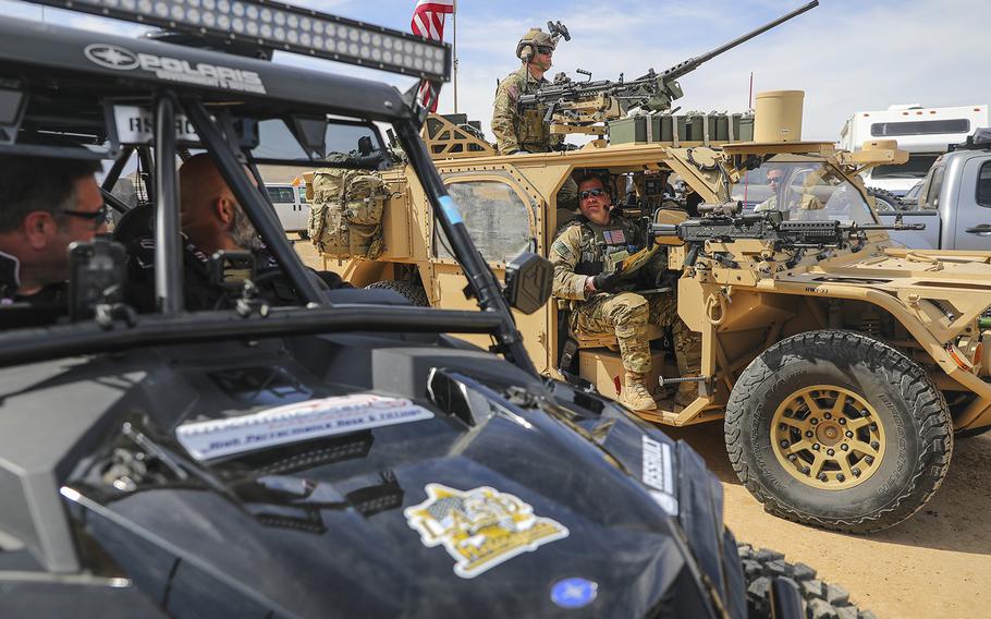 Green Berets with the 5th Special Forces Group (Airborne), converse with other racers prior to racing in the Mint 400, March 06, 2020, in Primm, Nevada. 
