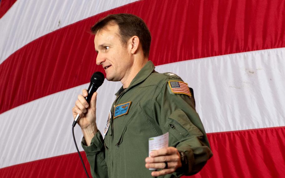 Capt. Brett Crozier, then-commanding officer of the aircraft carrier USS Theodore Roosevelt addresses the crew during an all-hands call in the ship’s hangar bay March 3, 2020.  Crozier was relieved of command after his letter that warned sailors could die from the coronavirus outbreak aboard the carrier was leaked to the media.

